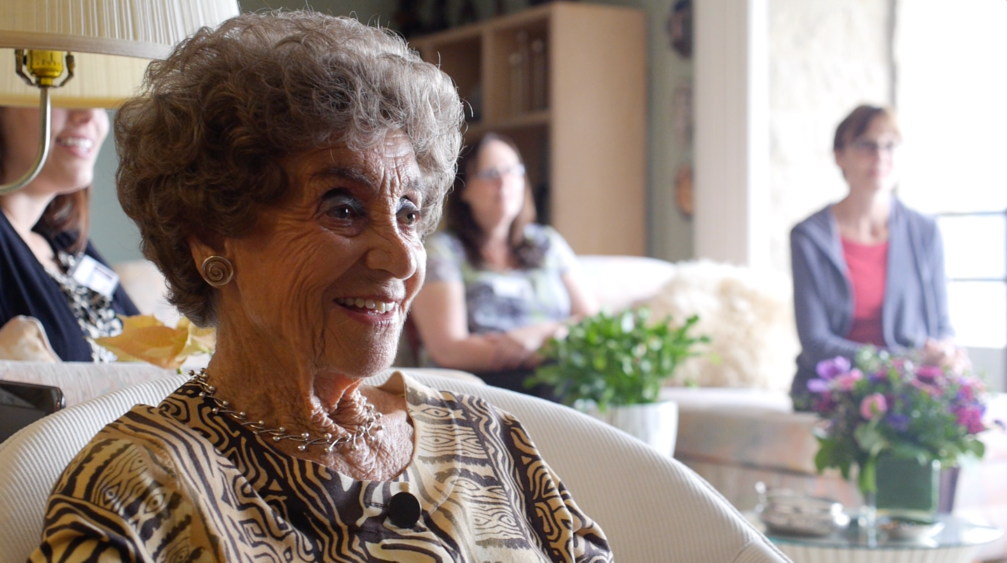 Lotte Hoffman, hospice patient, watching her life review video, a gift from Hospice Care of the West. 